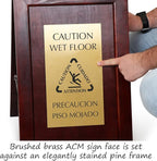 SmartSign Premium Bilingual "Caution Wet Floor" Wooden A-Frame Standing Floor Sign with Symbol, 2-Sided, 24" x 15", Hardwood Pine Frame, 120 mil Brass ACM Sign Face, Black on Gold, Made in USA